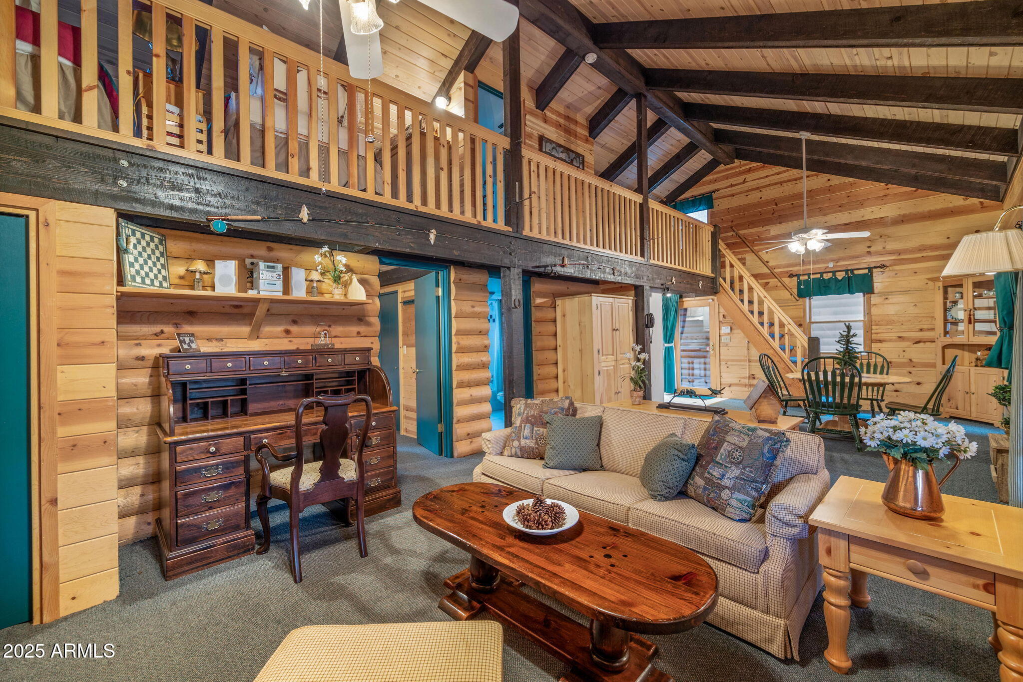 2677 Jackrabbit Drive Pinetop, AZ 85935 - Photo 34 of 87 a view of a patio with couches table and chairs with wooden floor