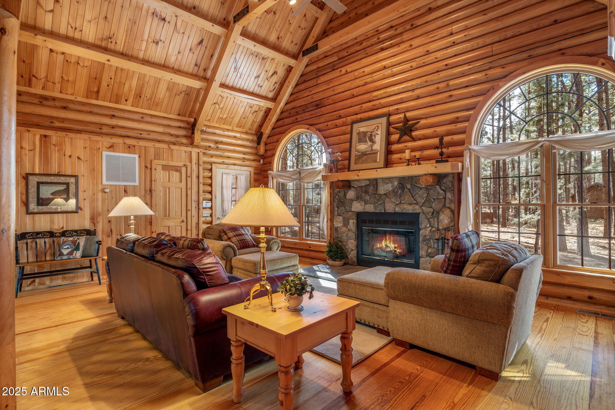 2677 Jackrabbit Drive Pinetop, AZ 85935 - Photo 3 of 87 a living room with furniture a fireplace and a large window