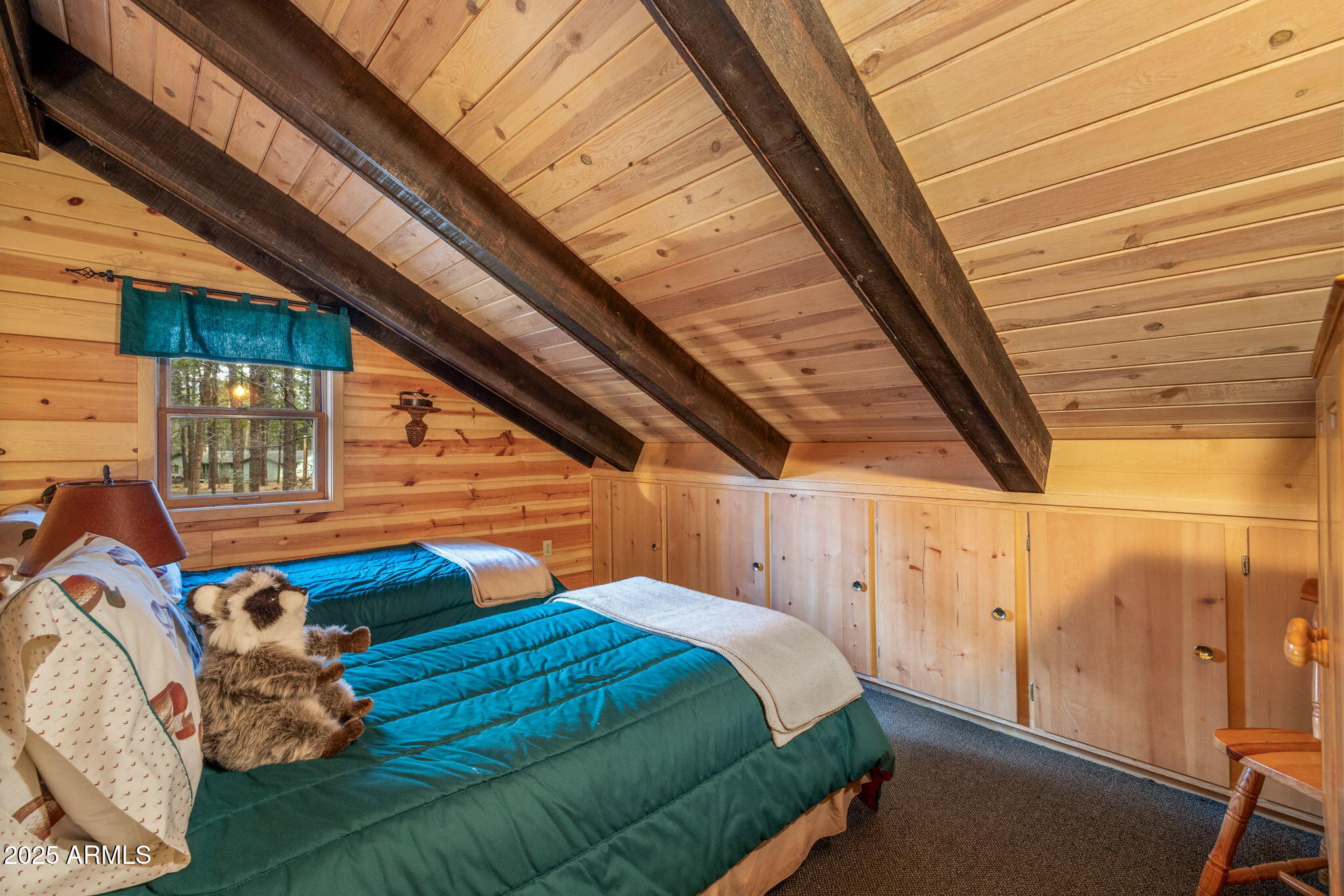 2677 Jackrabbit Drive Pinetop, AZ 85935 - Photo 45 of 87 a bed sitting in a bedroom next to a window