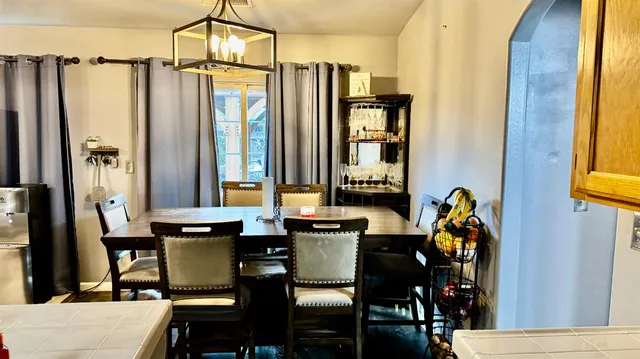 a kitchen with a stove a sink and a refrigerator