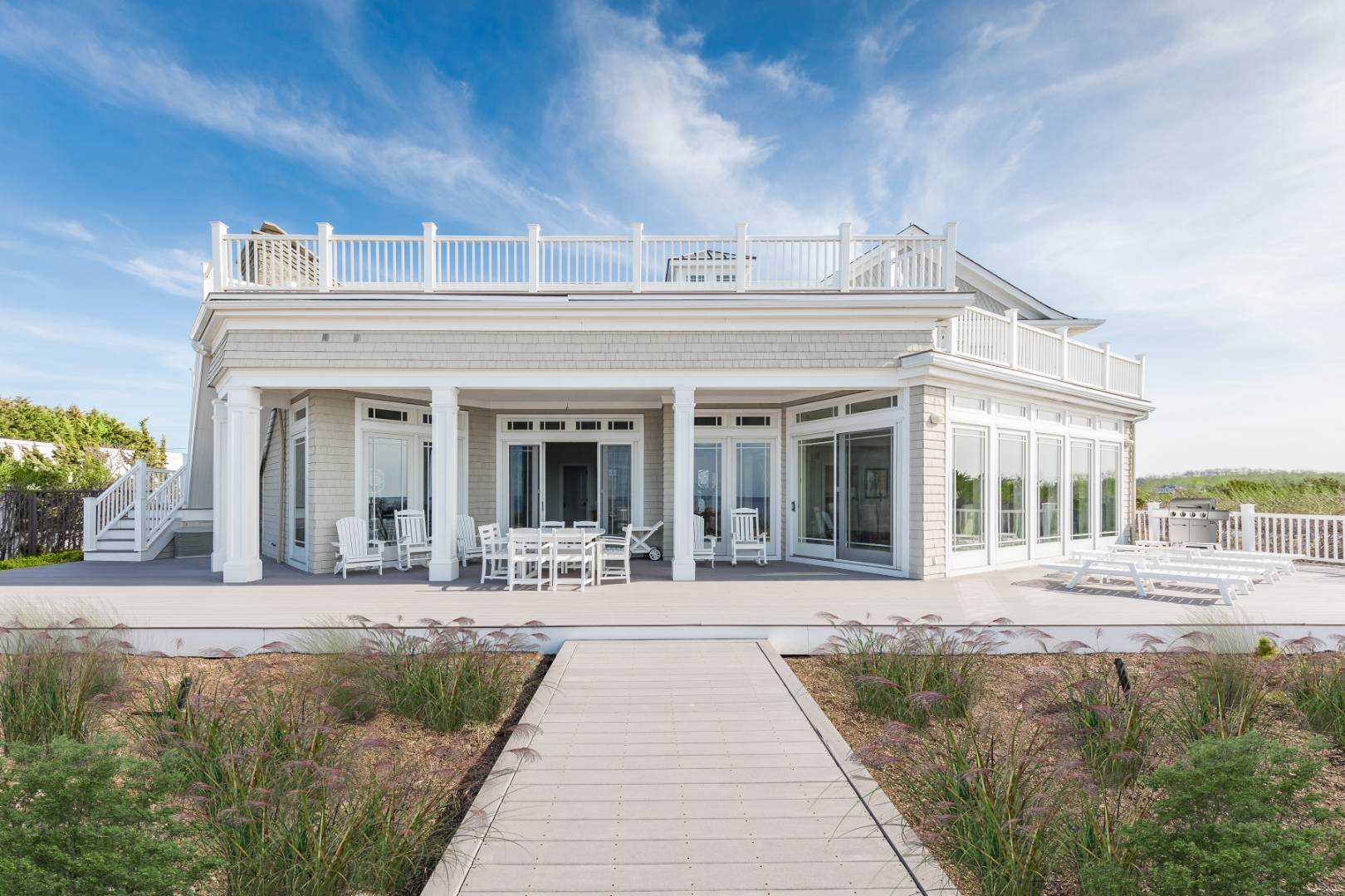 351 Kings Point Road East Hampton, NY 11937 - Photo 13 of 34 a front view of a building with a garden