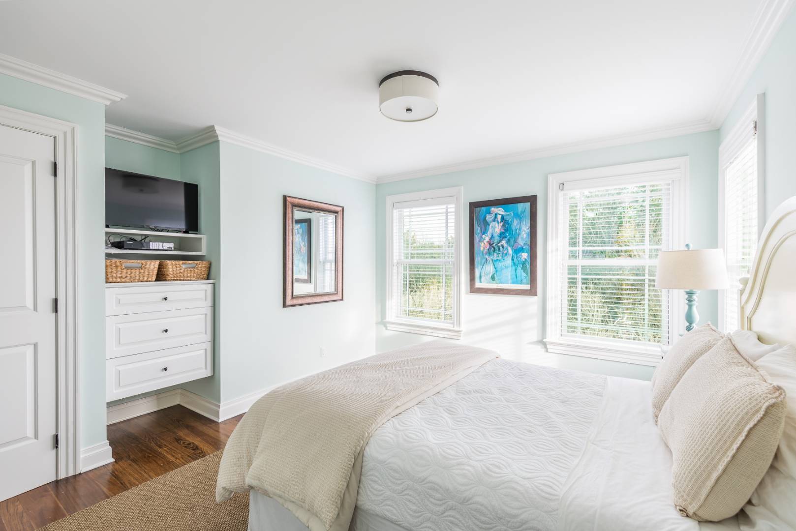 351 Kings Point Road East Hampton, NY 11937 - Photo 22 of 34 a bedroom with a bed and a flat screen tv
