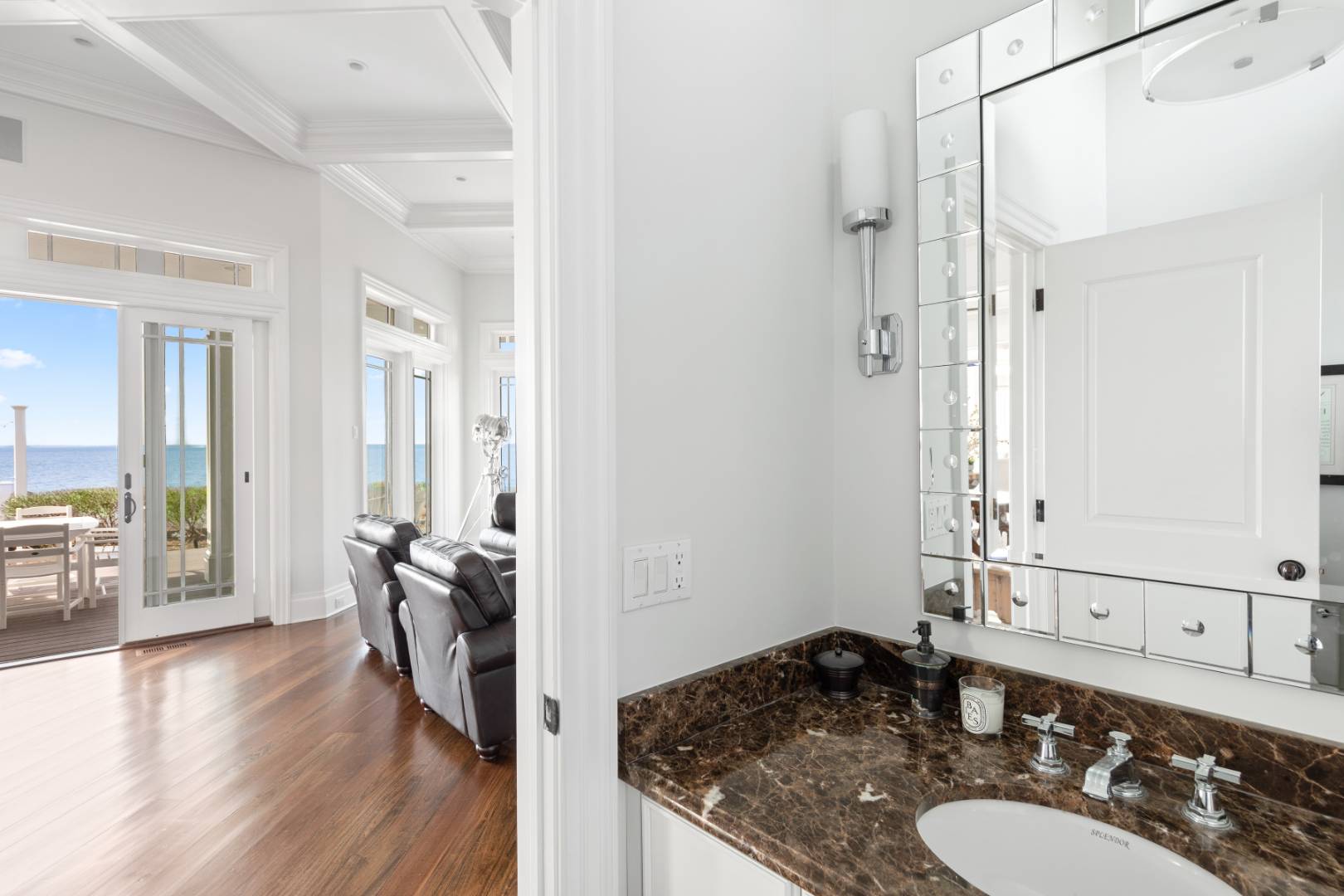 351 Kings Point Road East Hampton, NY 11937 - Photo 23 of 34 a bathroom with a granite countertop sink a mirror and shower