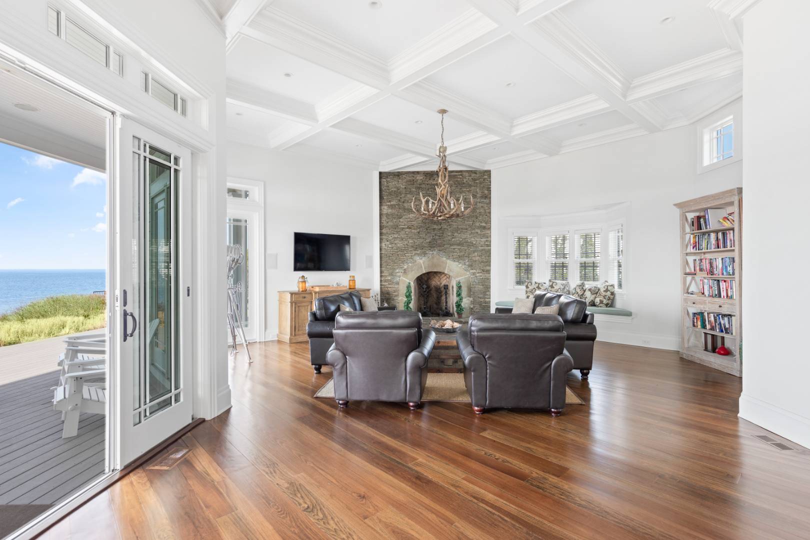 351 Kings Point Road East Hampton, NY 11937 - Photo 34 of 34 a living room with furniture a flat screen tv and a large window
