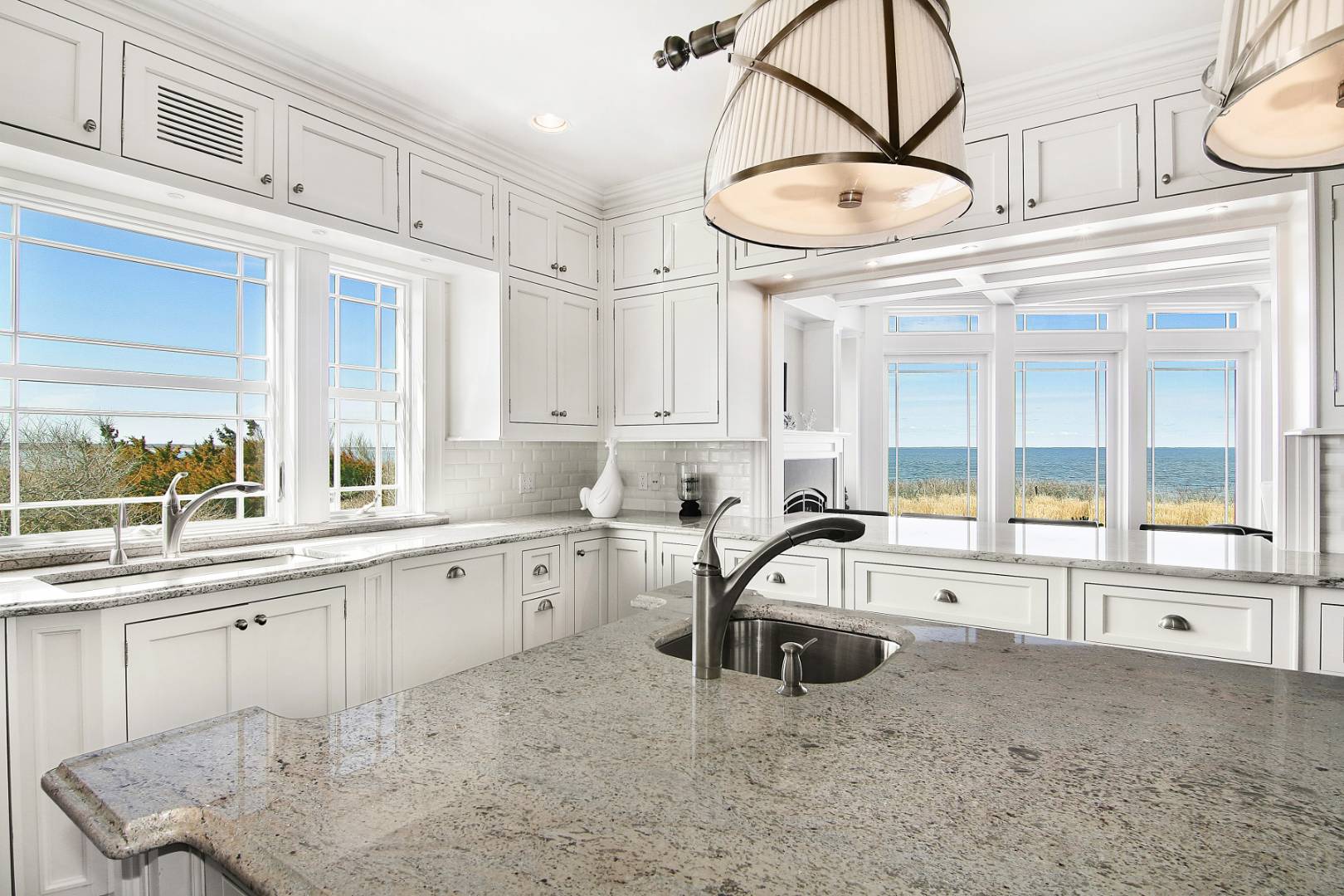 351 Kings Point Road East Hampton, NY 11937 - Photo 9 of 34 a kitchen with a sink a counter and cabinets