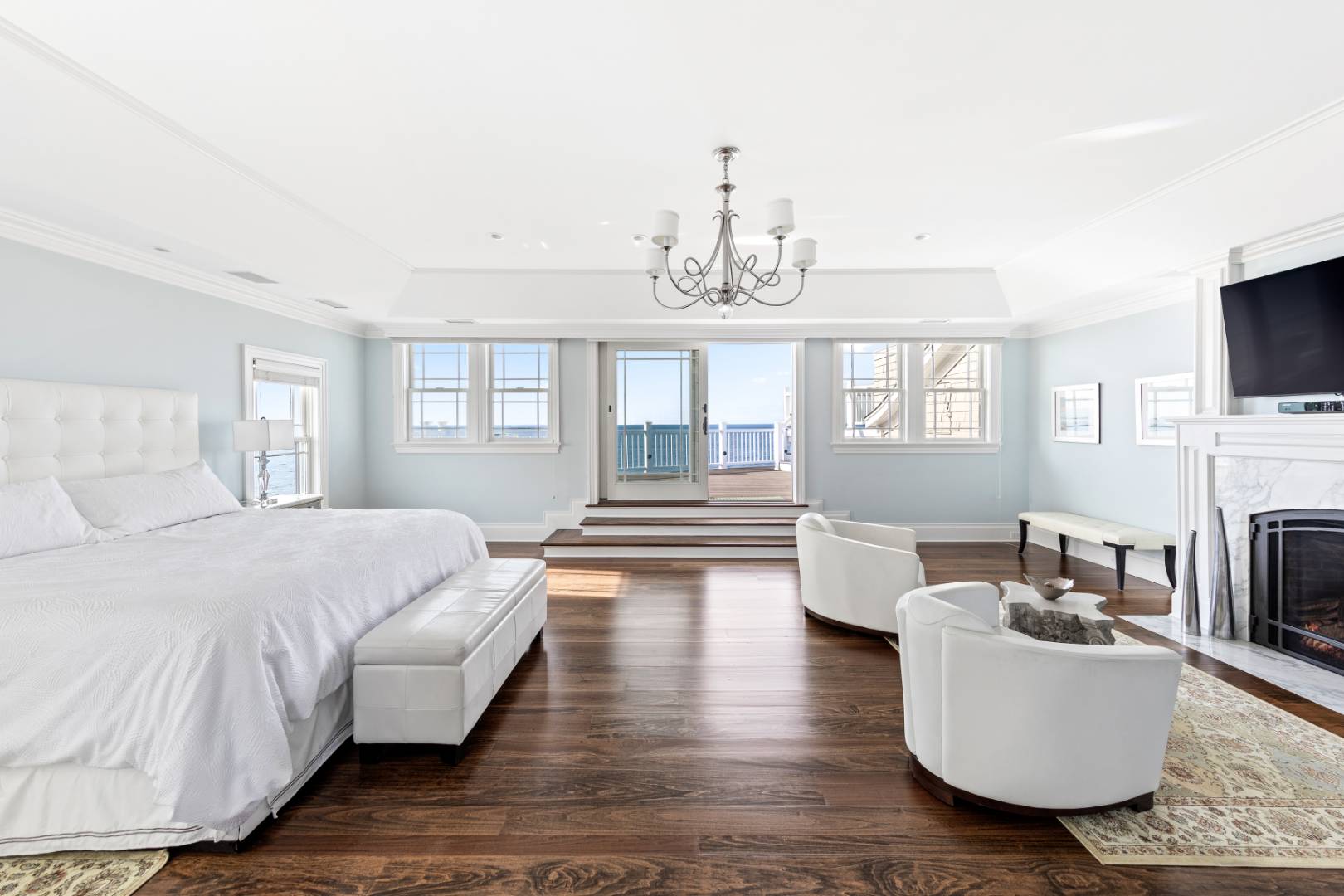 351 Kings Point Road East Hampton, NY 11937 - Photo 10 of 34 a bedroom with furniture and a fireplace