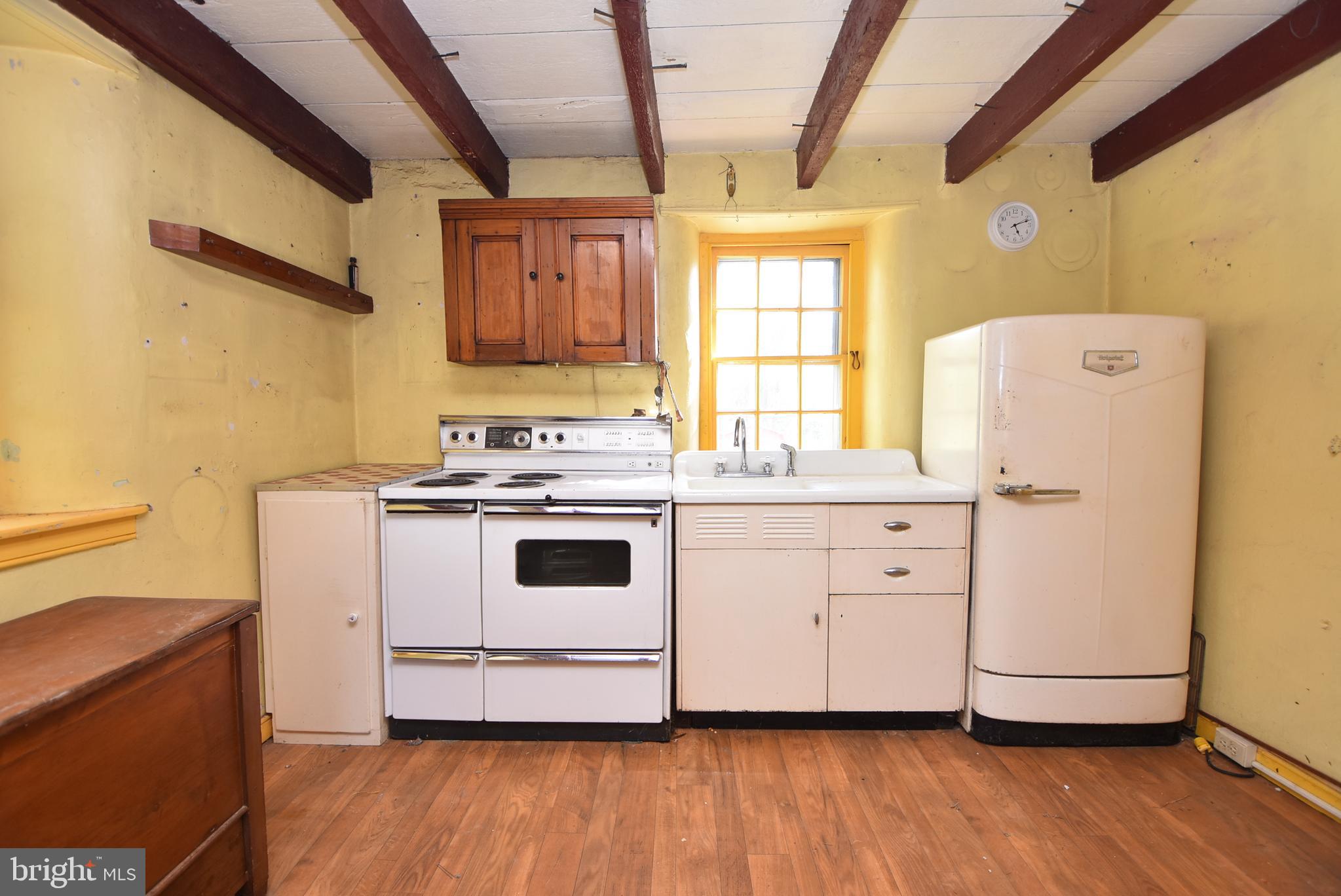 210 Buckwalter Road Phoenixville, PA 19460 - Photo 14 of 60 a white stove top oven sitting inside of a kitchen