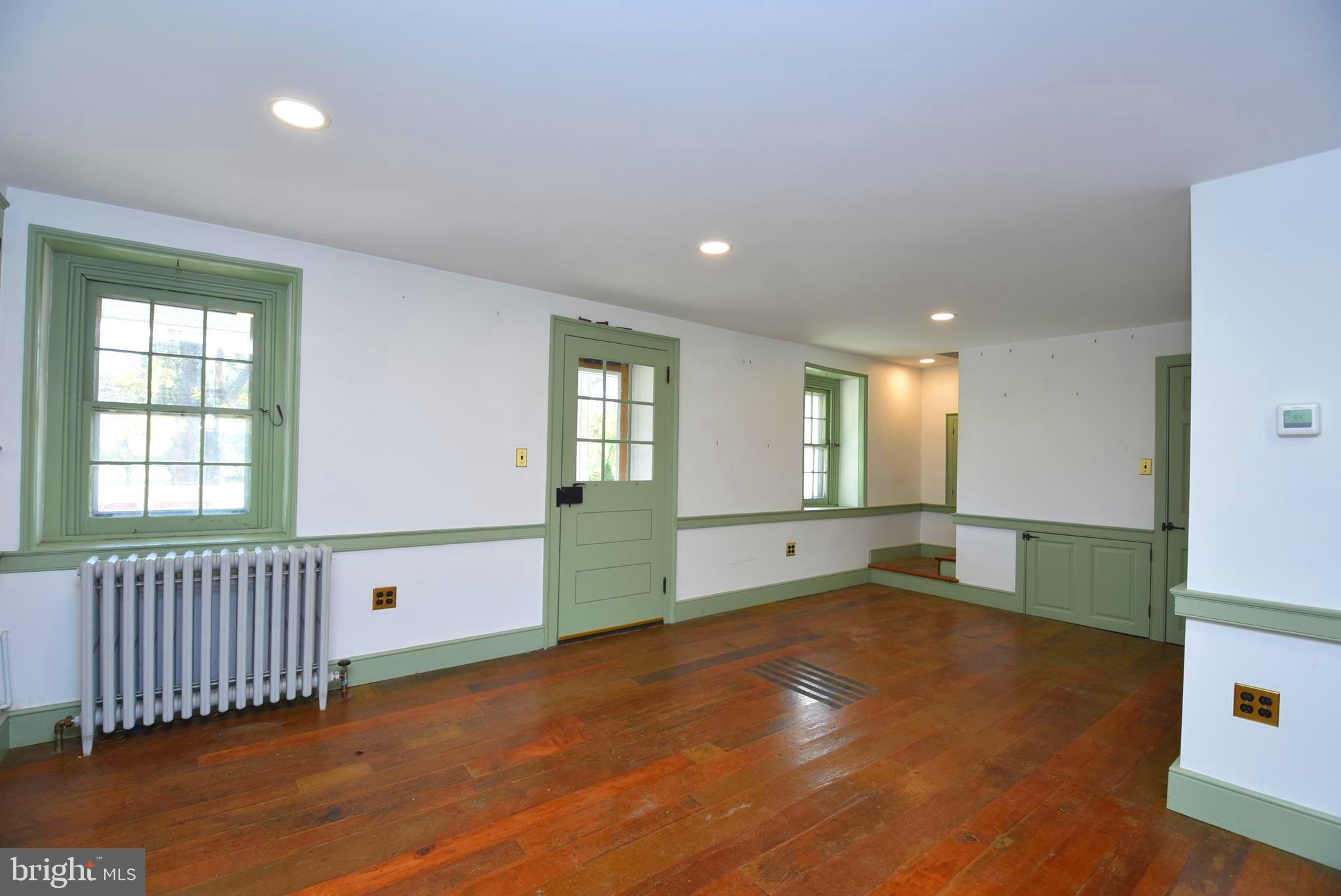 210 Buckwalter Road Phoenixville, PA 19460 - Photo 21 of 60 an empty room with windows and pillars in it
