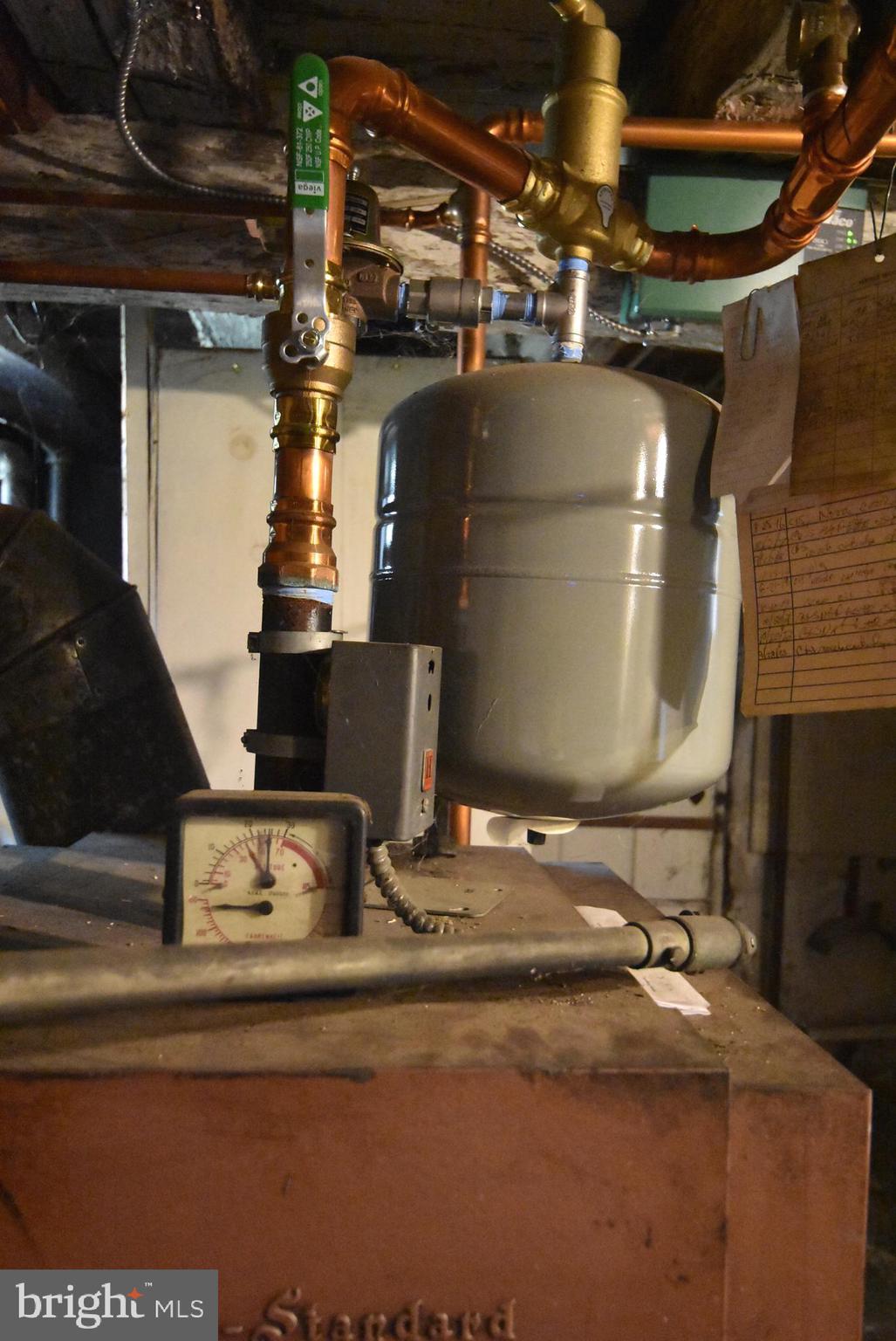 210 Buckwalter Road Phoenixville, PA 19460 - Photo 33 of 60 a room with water heater and car