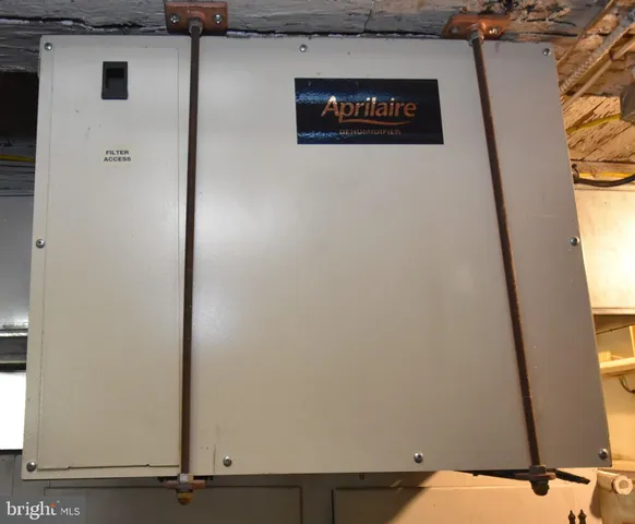 a view of a small house with a yard