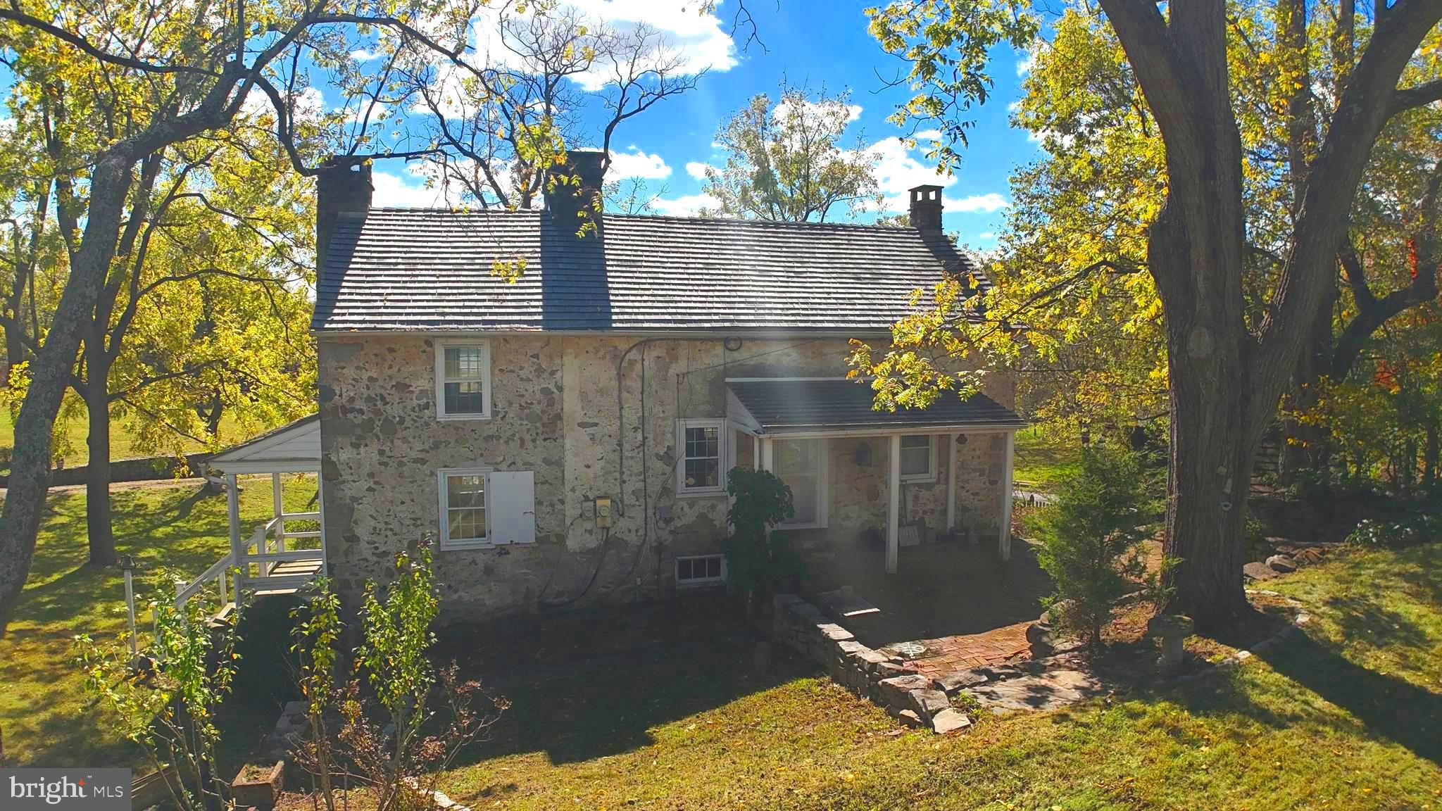 210 Buckwalter Road Phoenixville, PA 19460 - Photo 38 of 60 a backyard of a house with table and chairs
