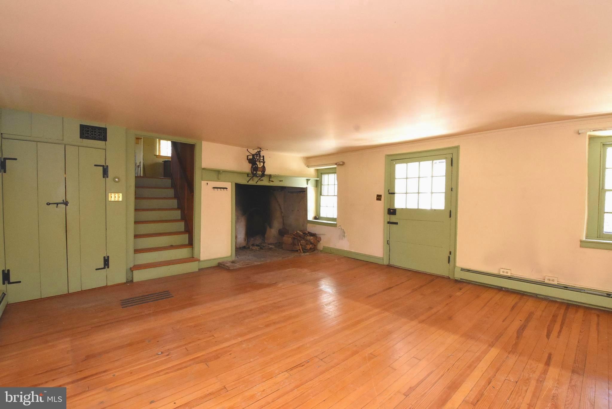 210 Buckwalter Road Phoenixville, PA 19460 - Photo 10 of 60 a view of empty room with wooden floor and fan