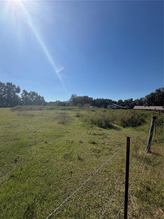 Tbd Northeast 25th Avenue Anthony, FL 32617 - Photo 10 of 12 a view of a lake with houses in the back