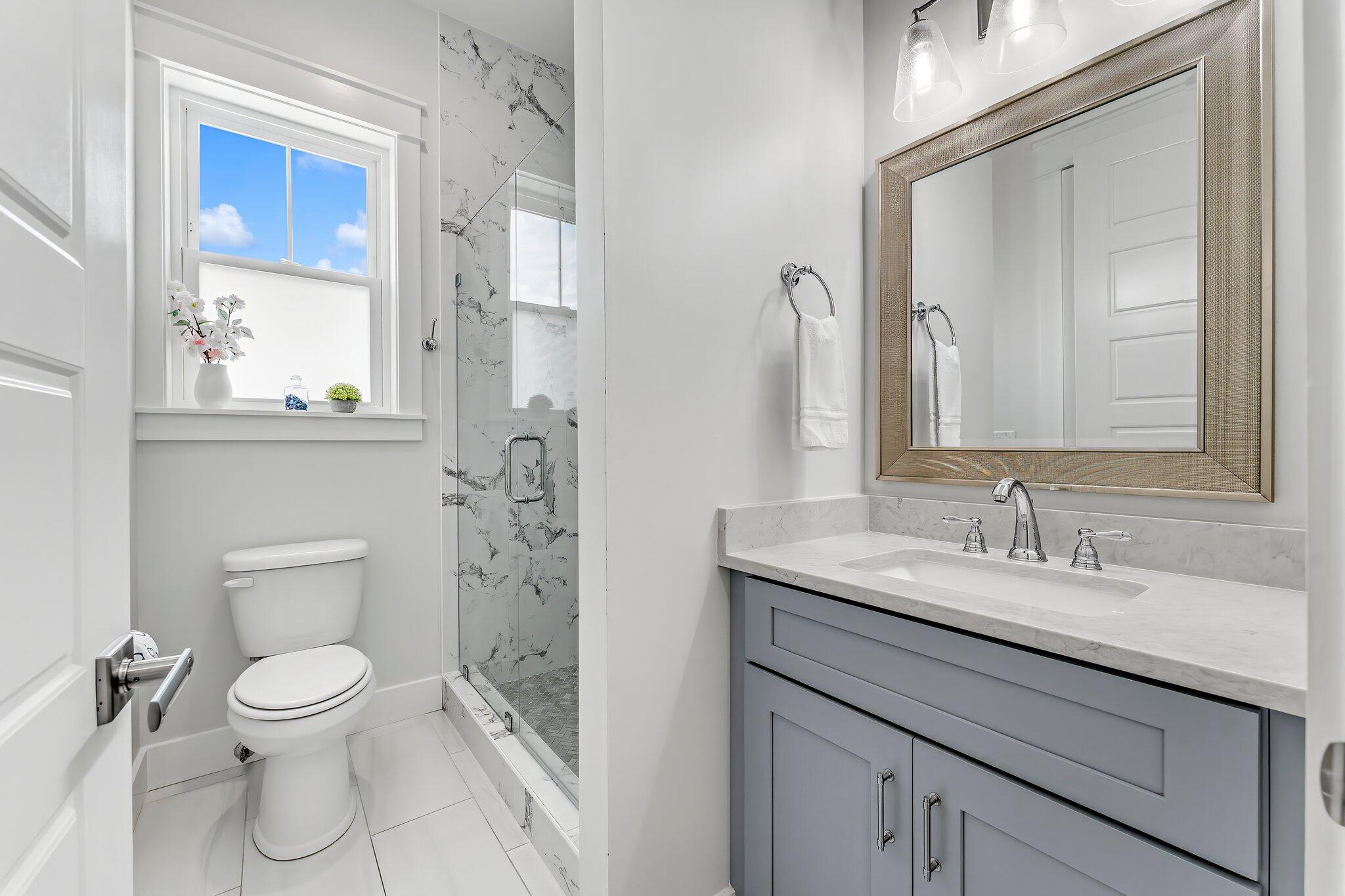 550 Gulfview Circle Santa Rosa Beach, FL 32459 - Photo 29 of 44 a bathroom with a toilet sink and mirror
