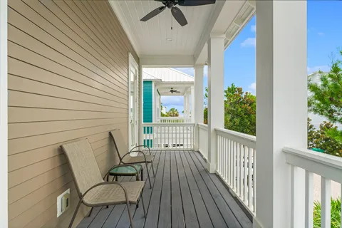 a view of a balcony with furniture