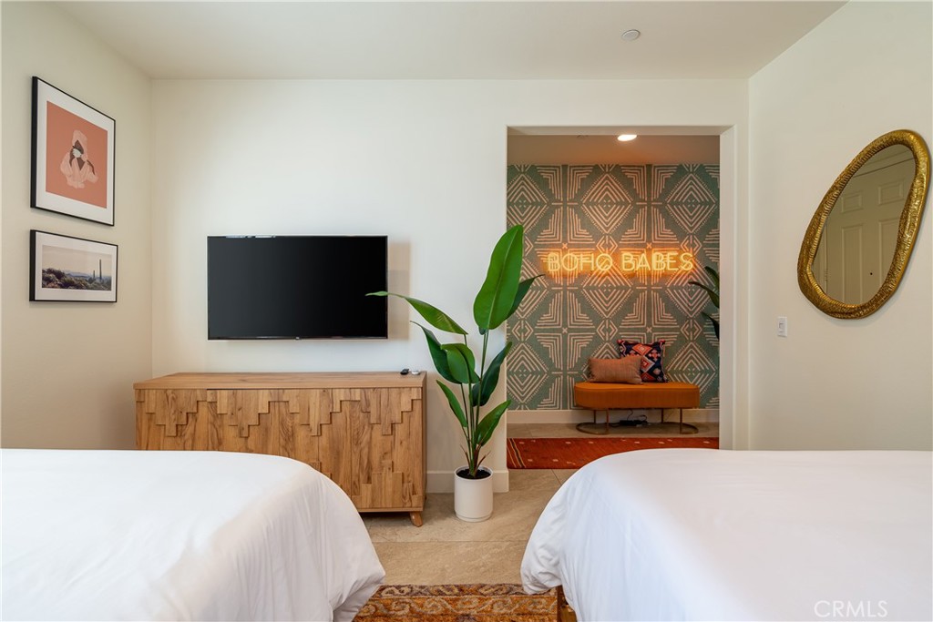 82872 Wordsworth Court Indio, CA 92201 - Photo 17 of 62 a bedroom with a bed and a flat screen tv