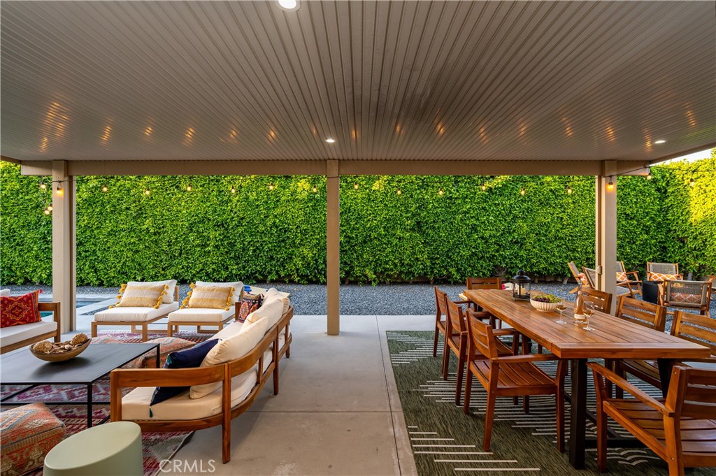82872 Wordsworth Court Indio, CA 92201 - Photo 28 of 62 a patio with yard glass top table and chairs