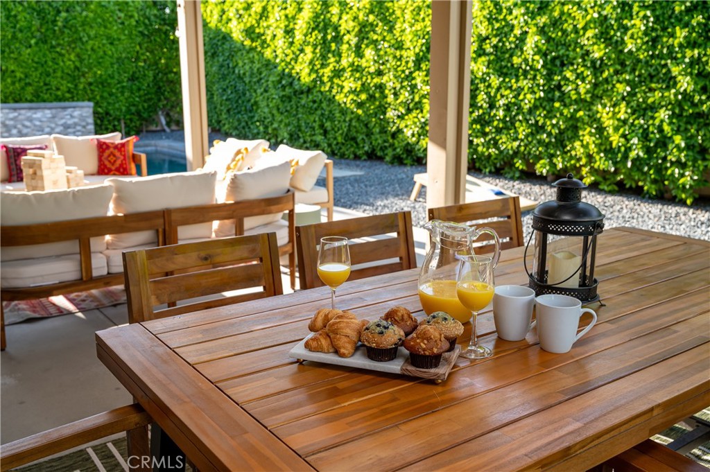 82872 Wordsworth Court Indio, CA 92201 - Photo 46 of 62 a view of a deck with table and chairs with wooden floor