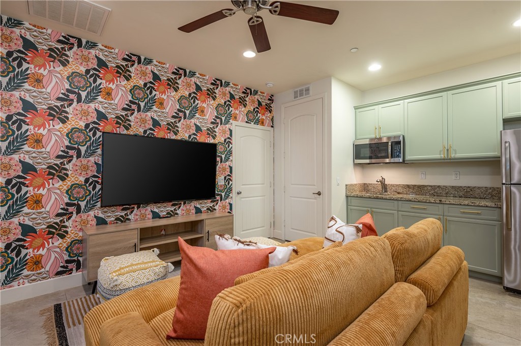 82872 Wordsworth Court Indio, CA 92201 - Photo 59 of 62 a living room with furniture and a flat screen tv
