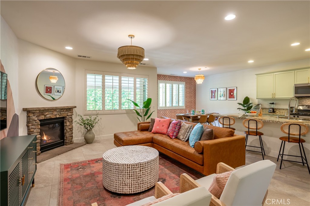 82872 Wordsworth Court Indio, CA 92201 - Photo 6 of 62 a living room with furniture a fireplace and a large window
