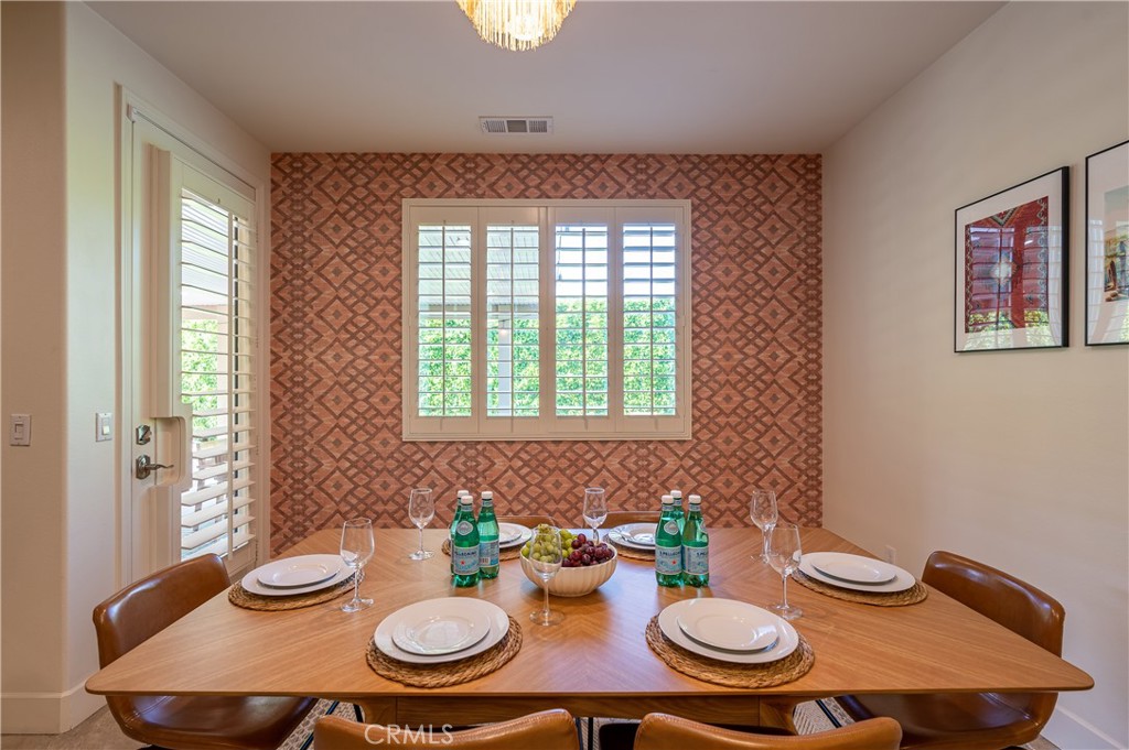 82872 Wordsworth Court Indio, CA 92201 - Photo 10 of 62 a table and chairs in a dining room with a table