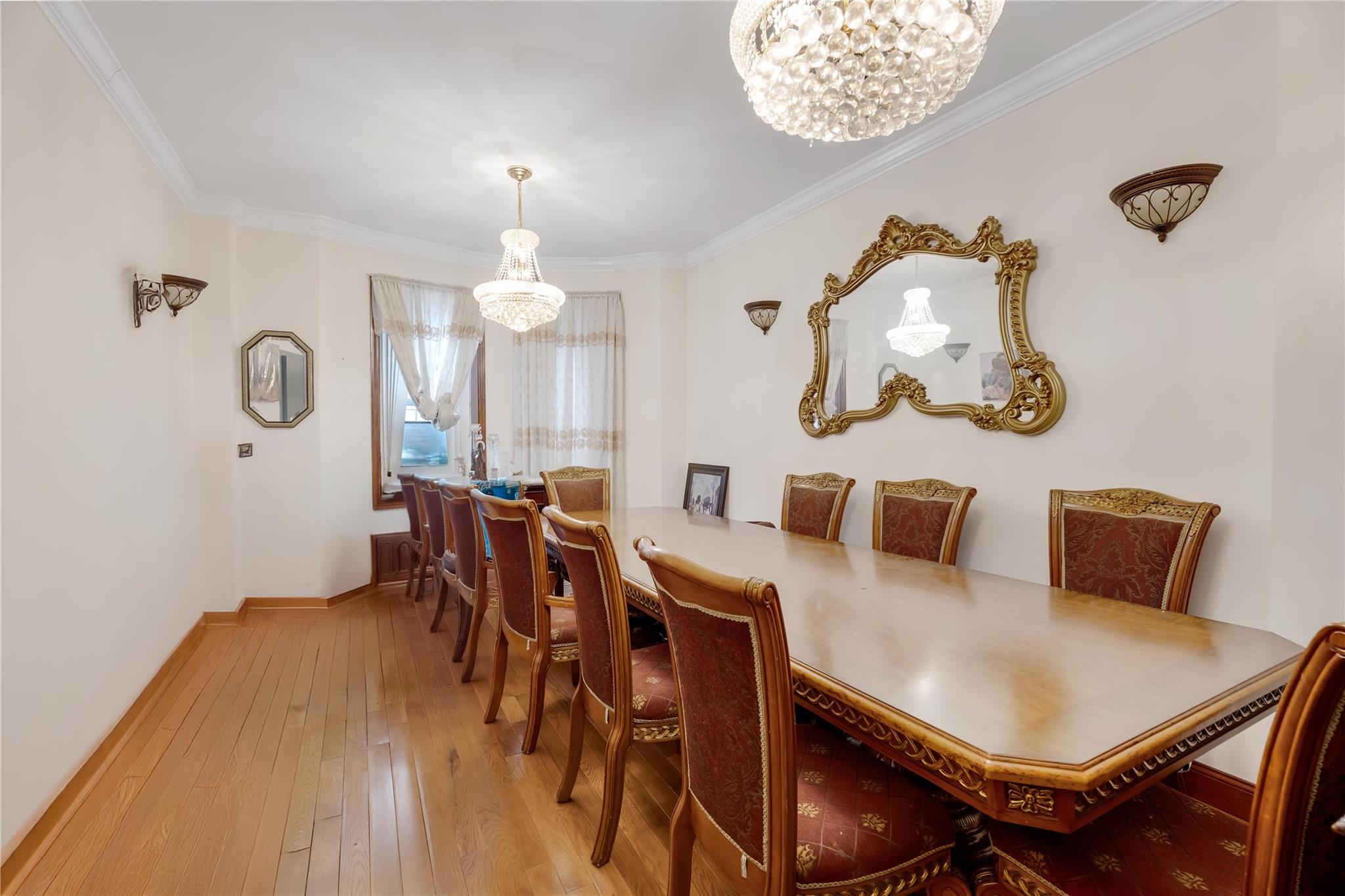 1520 Lincoln Place Brooklyn, NY 11213 - Photo 2 of 7 a view of a dining room with furniture and chandelier