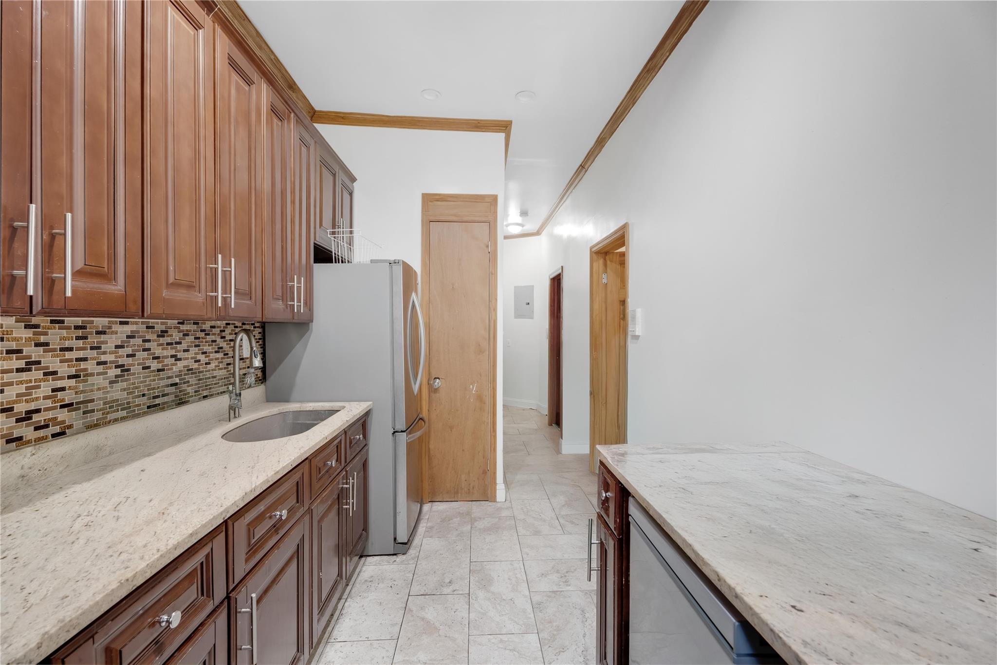 1520 Lincoln Place Brooklyn, NY 11213 - Photo 4 of 7 a kitchen with a sink stove and cabinets