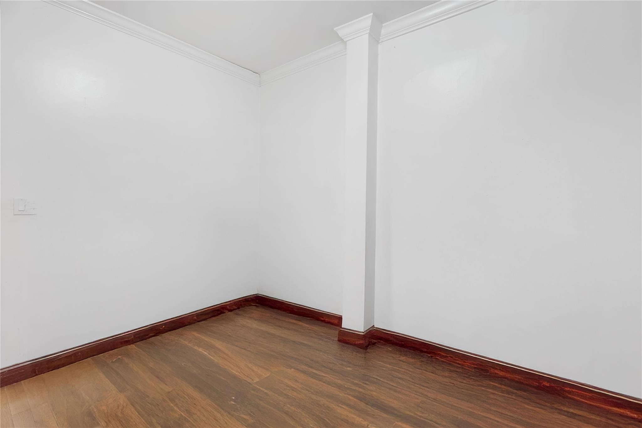 1520 Lincoln Place Brooklyn, NY 11213 - Photo 6 of 7 a view of an empty room with wooden floor