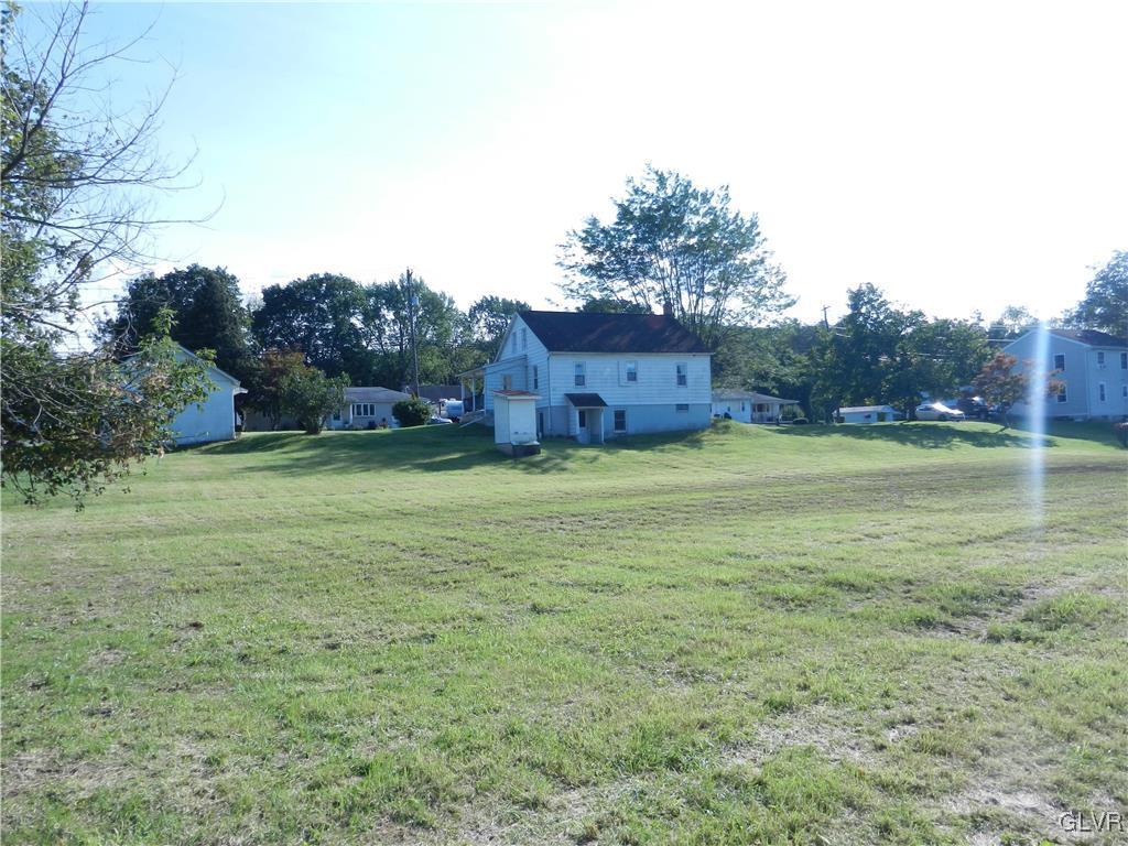 5027 Huckleberry Road Orefield, PA 18069 - Photo 6 of 17 a view of a large body of water with a building in the background