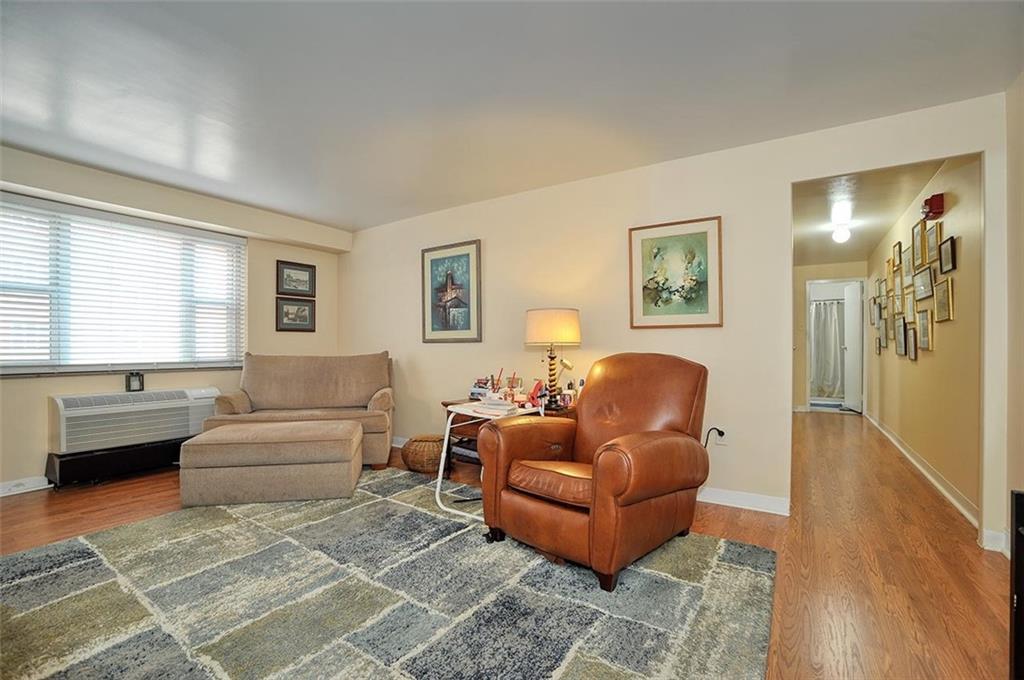 4625 Fifth Avenue, Unit 211 Pittsburgh, PA 15213 - Photo 6 of 14 a living room with furniture and a window