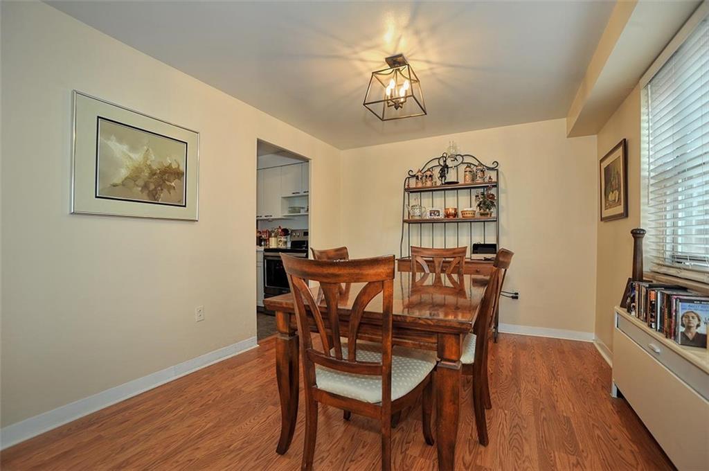 4625 Fifth Avenue, Unit 211 Pittsburgh, PA 15213 - Photo 9 of 14 a view of a dining room with furniture and wooden floor