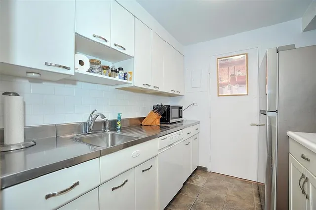 a kitchen with cabinets and a sink