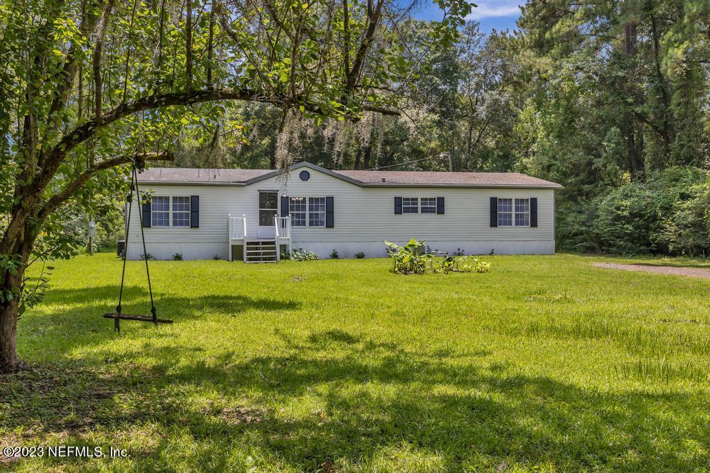 45292 Arline Road Callahan, FL 32011 - Photo 1 of 38 a house view with swimming pool