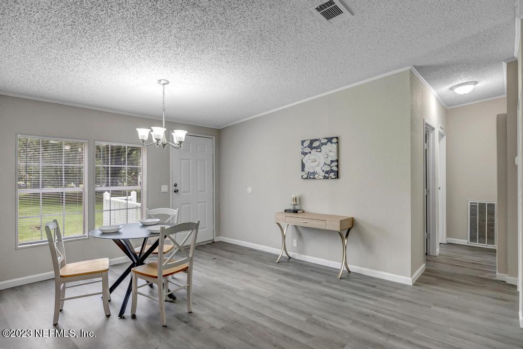 45292 Arline Road Callahan, FL 32011 - Photo 36 of 38 a view of a dining room with furniture window and wooden floor