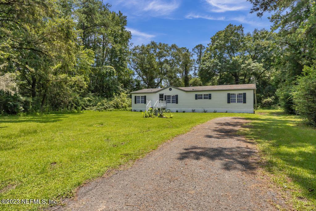 45292 Arline Road Callahan, FL 32011 - Photo 4 of 38 a view of house with a big yard