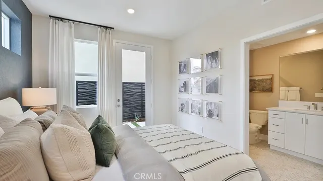 a bedroom with furniture and a large mirror