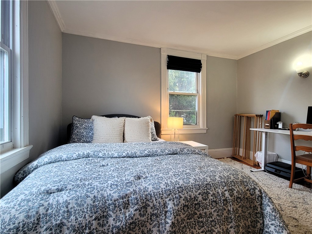 22 Annandale Road, Unit 2 Newport, RI 02840 - Photo 13 of 21 Primary bedroom with west-facing window for sunrise views!