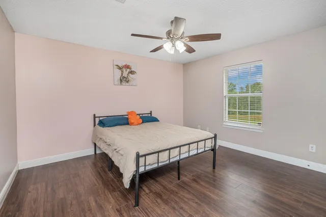 a very nice looking room with wooden floor