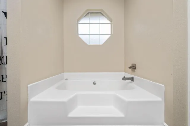 a bathroom with a bathtub