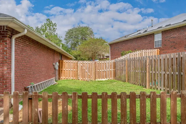 a view of a wooden fence