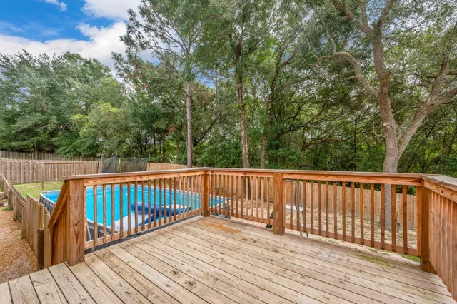 a view of deck with wooden floor and fence