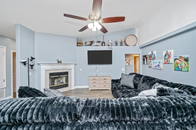 a bedroom with a large bed and a flat screen tv
