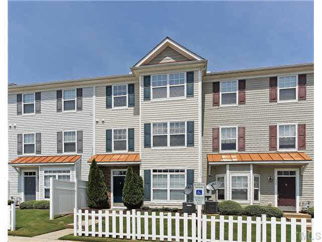 2225 Raven Road, Unit 106 Raleigh, NC 27614 - Photo 1 of 25 a front view of a residential apartment building with a yard