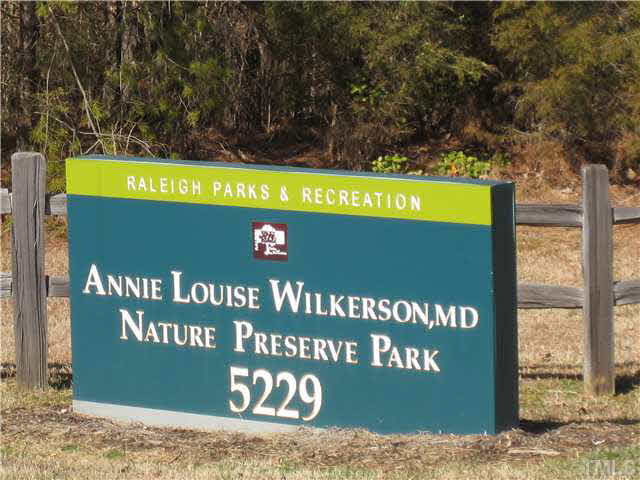 2225 Raven Road, Unit 106 Raleigh, NC 27614 - Photo 22 of 25 a sign that is sitting on a brick wall