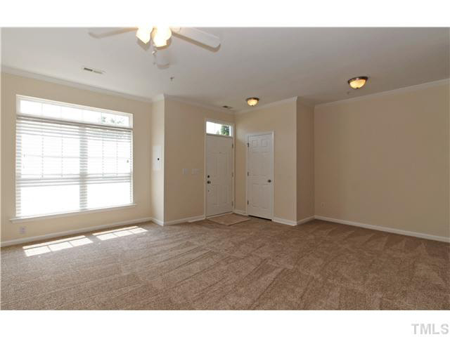 2225 Raven Road, Unit 106 Raleigh, NC 27614 - Photo 4 of 25 a view of an empty room with a window