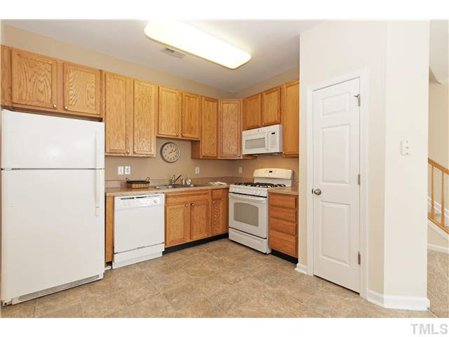 2225 Raven Road, Unit 106 Raleigh, NC 27614 - Photo 8 of 25 a kitchen with a refrigerator sink and cabinets