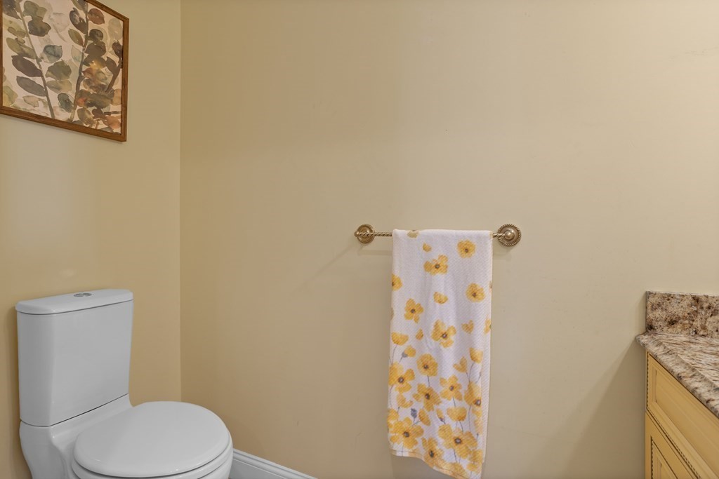 8 High Street, Unit D2 Acton, MA 01720 - Photo 13 of 35 a white toilet sitting next to a shower curtain