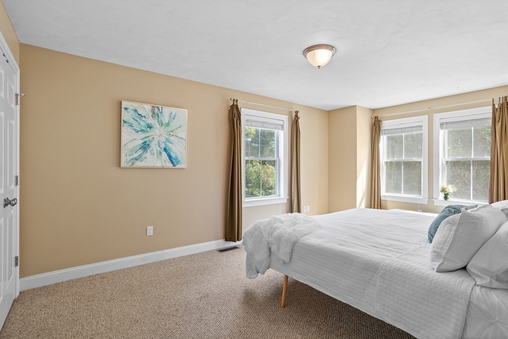 8 High Street, Unit D2 Acton, MA 01720 - Photo 16 of 35 a bedroom with a bed and a window