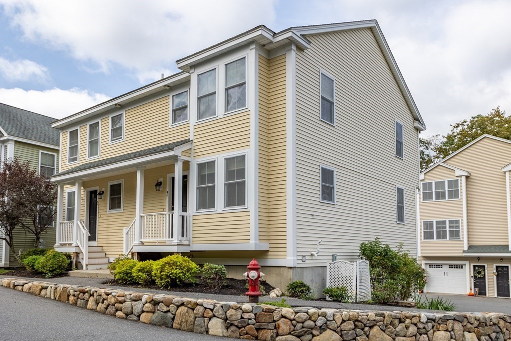 8 High Street, Unit D2 Acton, MA 01720 - Photo 2 of 35 a front view of a house with street