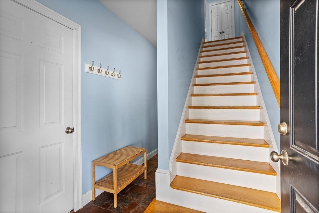 8 High Street, Unit D2 Acton, MA 01720 - Photo 22 of 35 a view of a hallway with wooden floor and entryway